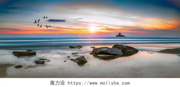 旅游风景海滩度假岩石日落背景图片